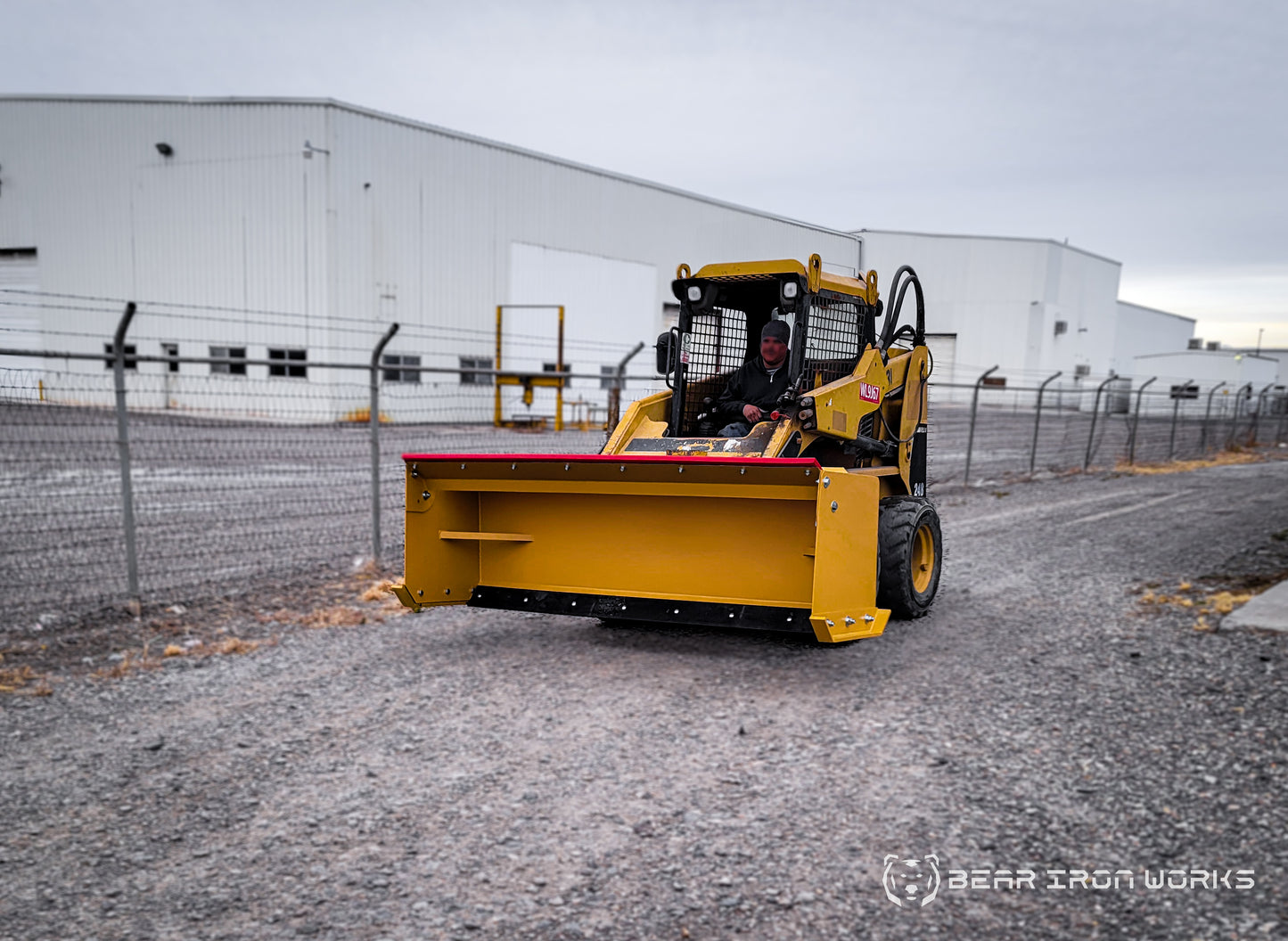 snow pusher attachment for skid steers